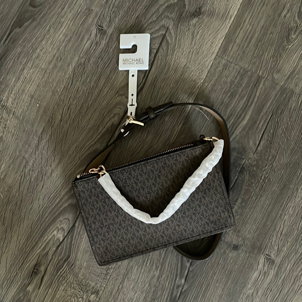Michael Kors signature chain belt bag. 

Chocolate color - tags still attached.